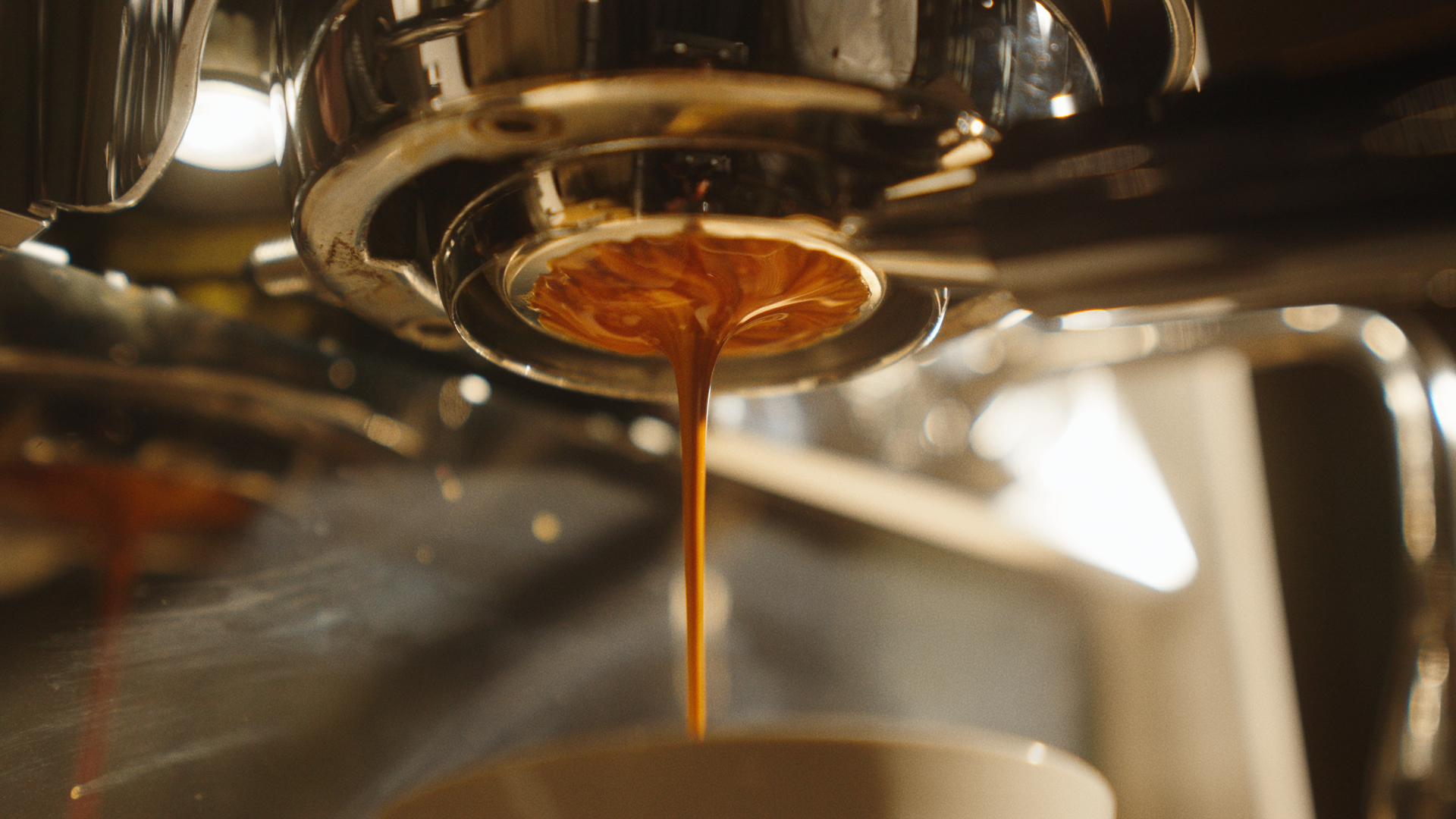 Espresso pulling from a portafilter