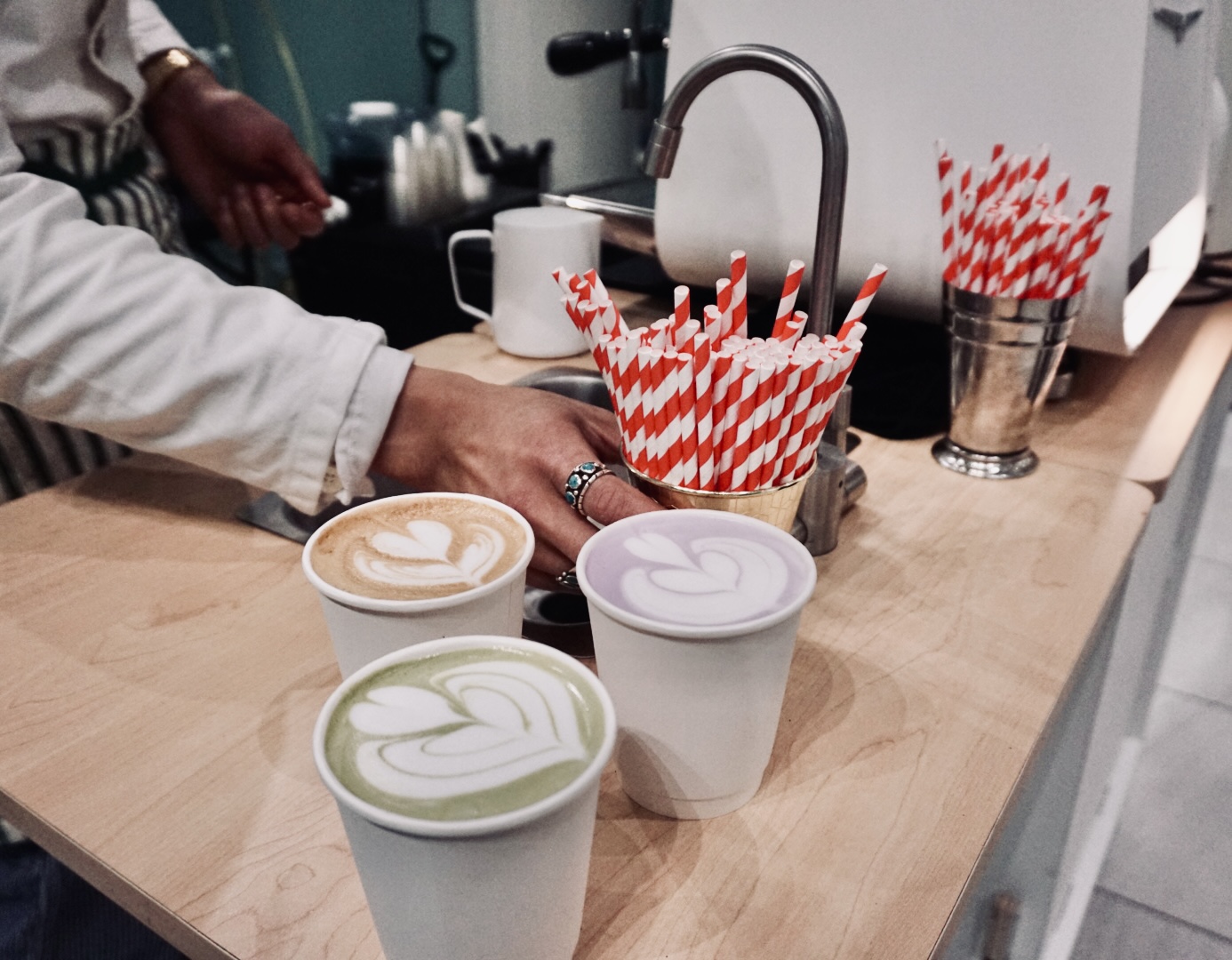 Three lattes on the cart counter